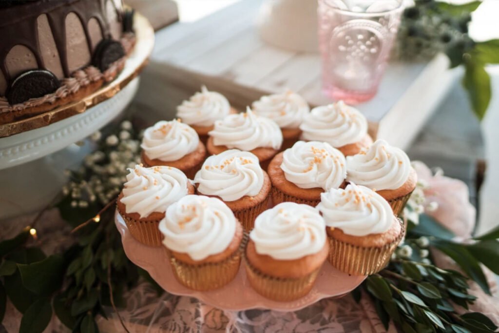 A dozen white wedding cupcakes