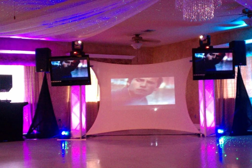 A trio of projection screens at an indoor wedding reception in Fredericksburg TX, provided by Cutting Edge Entertainment