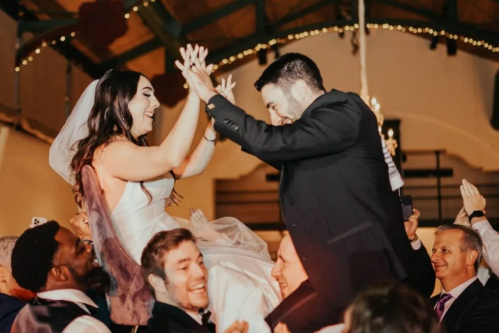 A bride and groom during the wedding Hora, depicting the fun at weddings in Fredericksburg TX