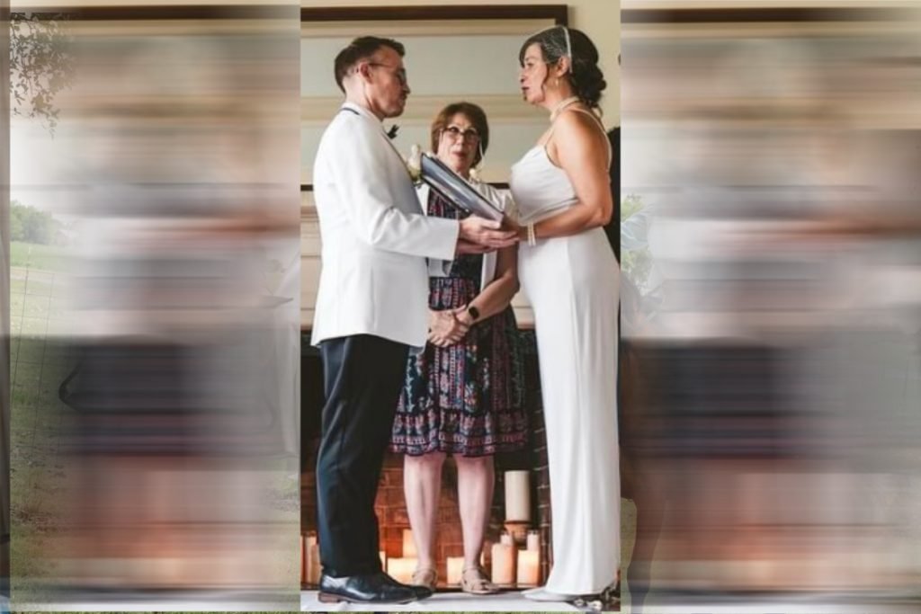 A female wedding officiant performs a wedding ceremony for a bride and groom.